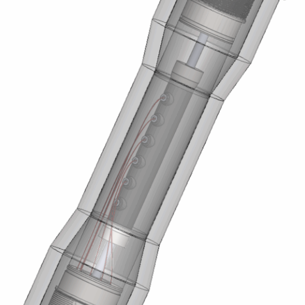 Cellule triaxiale en PEEK transparente aux rayons X, conçue par IRIAN MECATRONICS pour le BRGM, sur son banc d'essai pour la microtomographie.