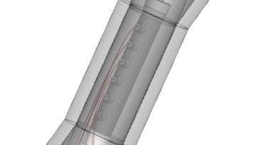 Cellule triaxiale en PEEK transparente aux rayons X, conçue par IRIAN MECATRONICS pour le BRGM, sur son banc d'essai pour la microtomographie.