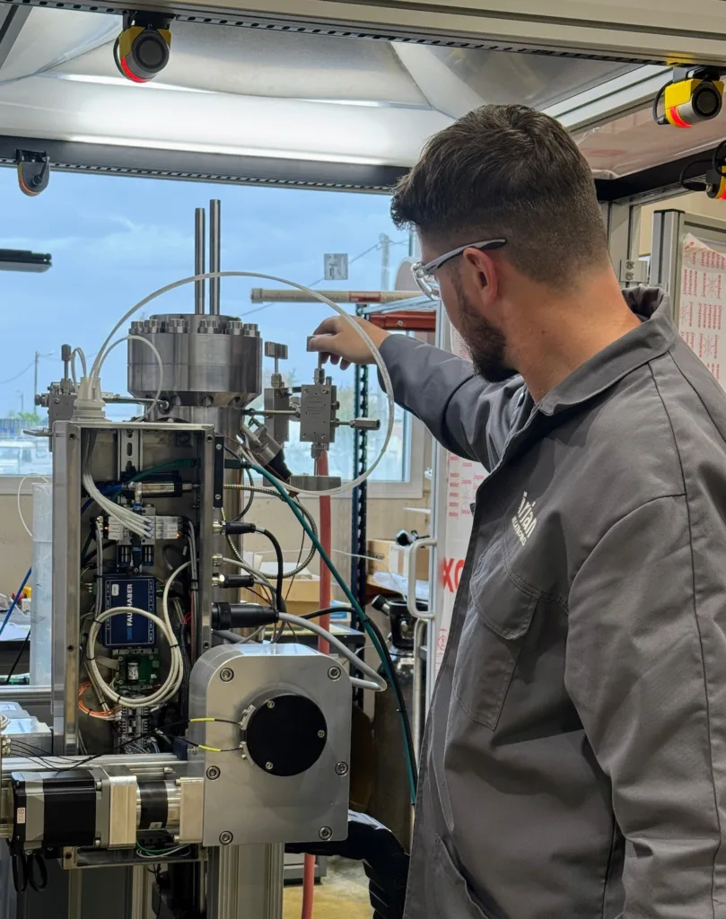 Engineer setting up a high-pressure syringe pump bench